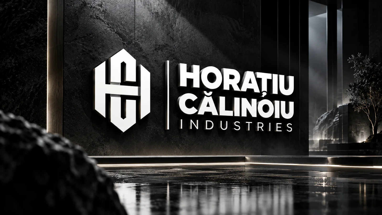 Logo-ul HC Industries pe un perete de piatră